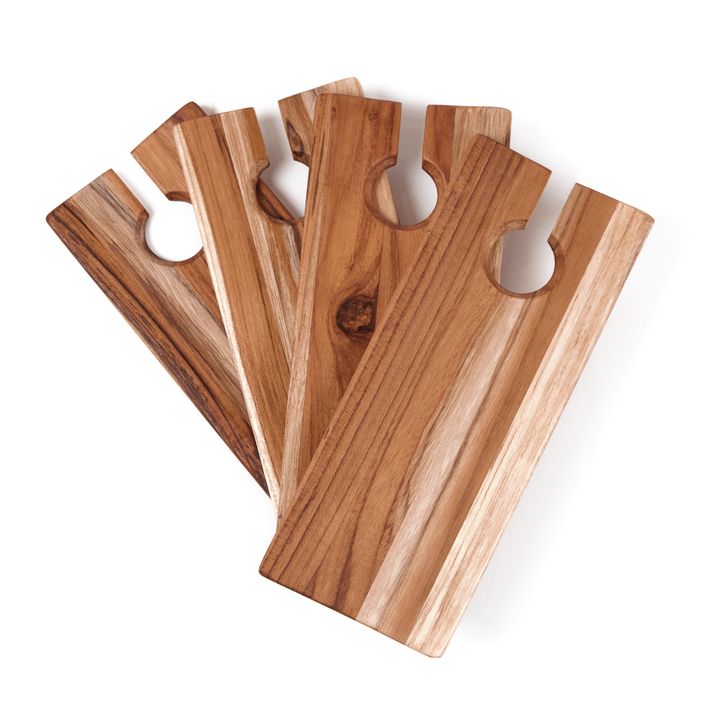 Set of four teakwood catering plates with wine glass cutouts, fanned out on a white background.