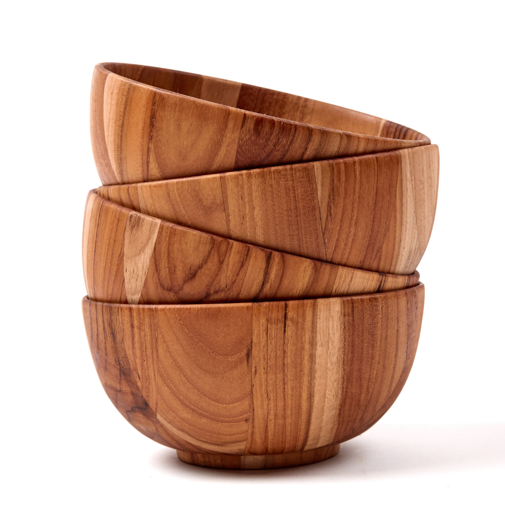 Four round teakwood moon serving bowls stacked vertically, showcasing unique wood grain and warm brown tones.
