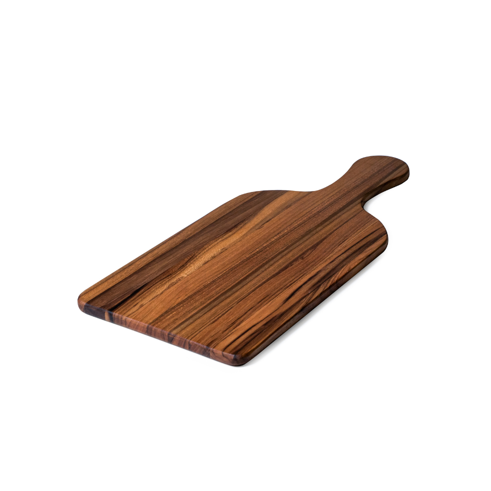 Rectangular teakwood paddle serving board with rich edge grain and a rounded handle on a white background.