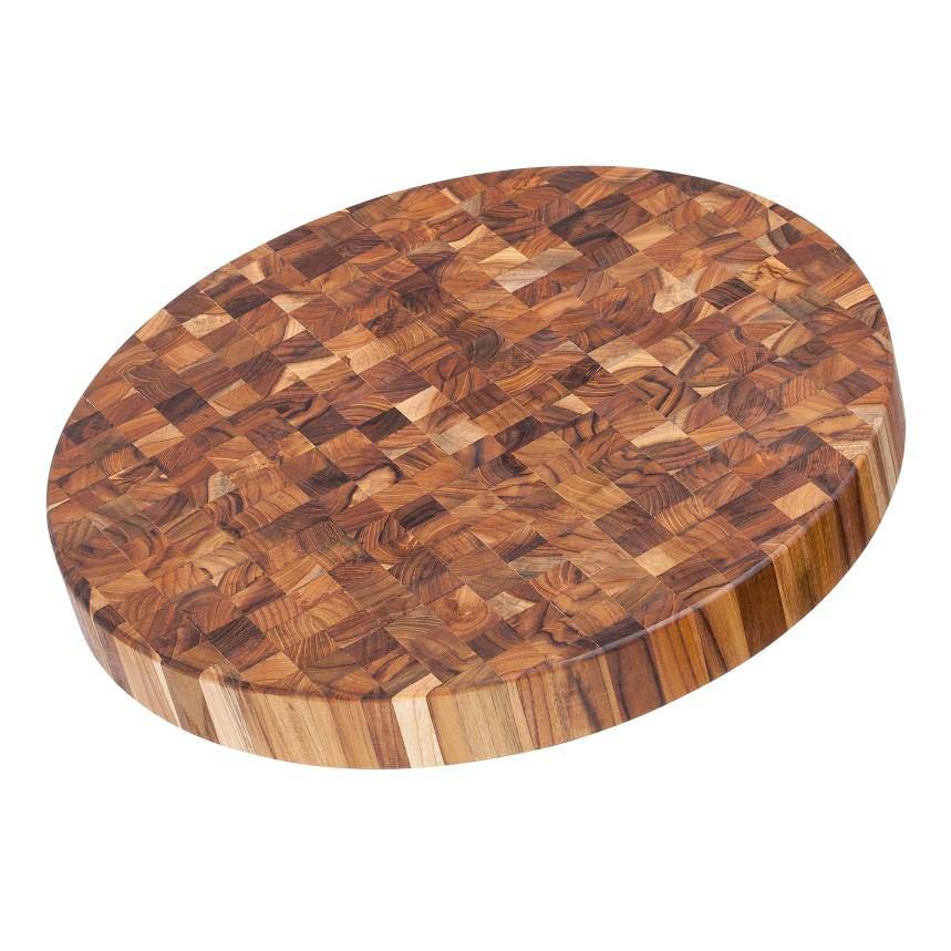 Thick circular teak end grain butcher block serving board featuring a natural checkered wood grain pattern.