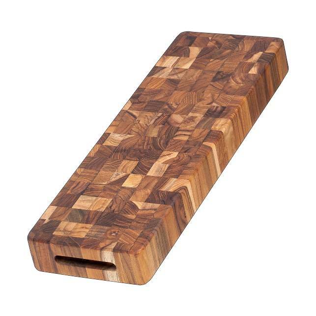 Long end grain teakwood cheese board featuring a thick butcher block design and integrated hand grip.