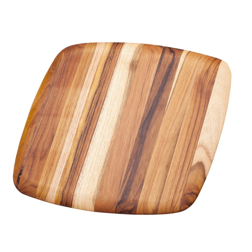 Square teakwood cutting board with rounded edges and a polished edge grain pattern.