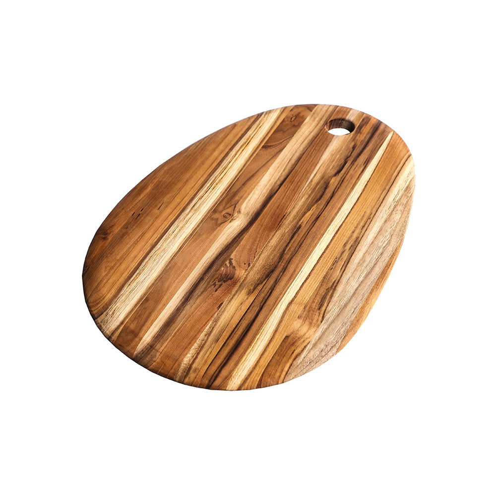 Small oval teakwood serving board with a natural edge grain pattern and integrated hanging hole.
