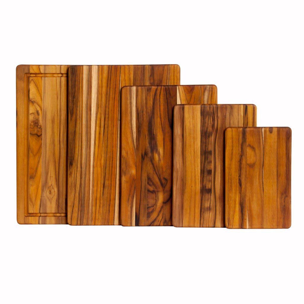Rectangular teakwood cutting boards in five graduated sizes featuring natural edge grain patterns.