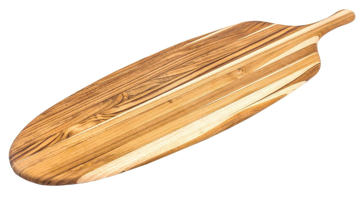 Long teakwood paddle serving board with edge grain and a sleek canoe-shaped design.