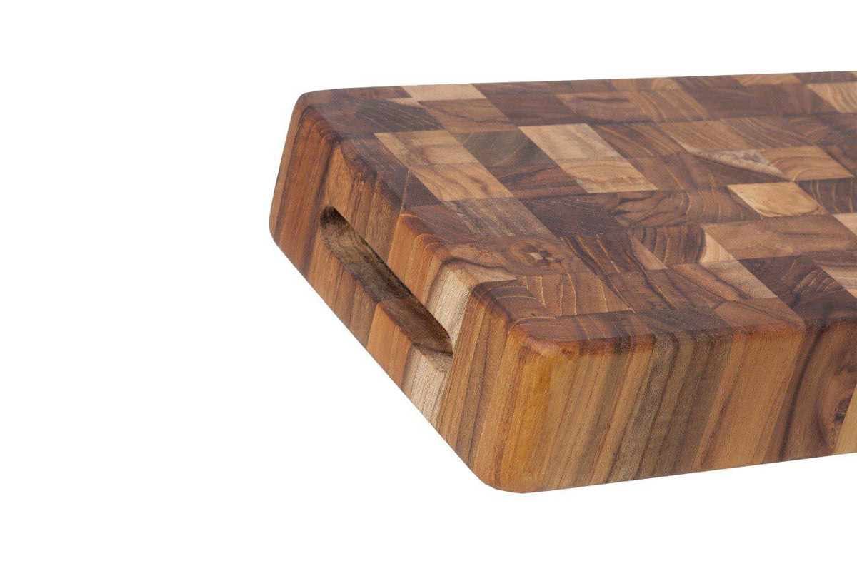 Thick end grain teakwood cheese board featuring a recessed hand grip and a natural checkered wood pattern.