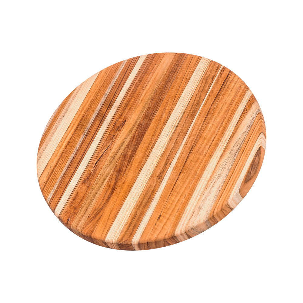 Round teakwood cutting and serving board with a natural edge grain and sustainable finish.
