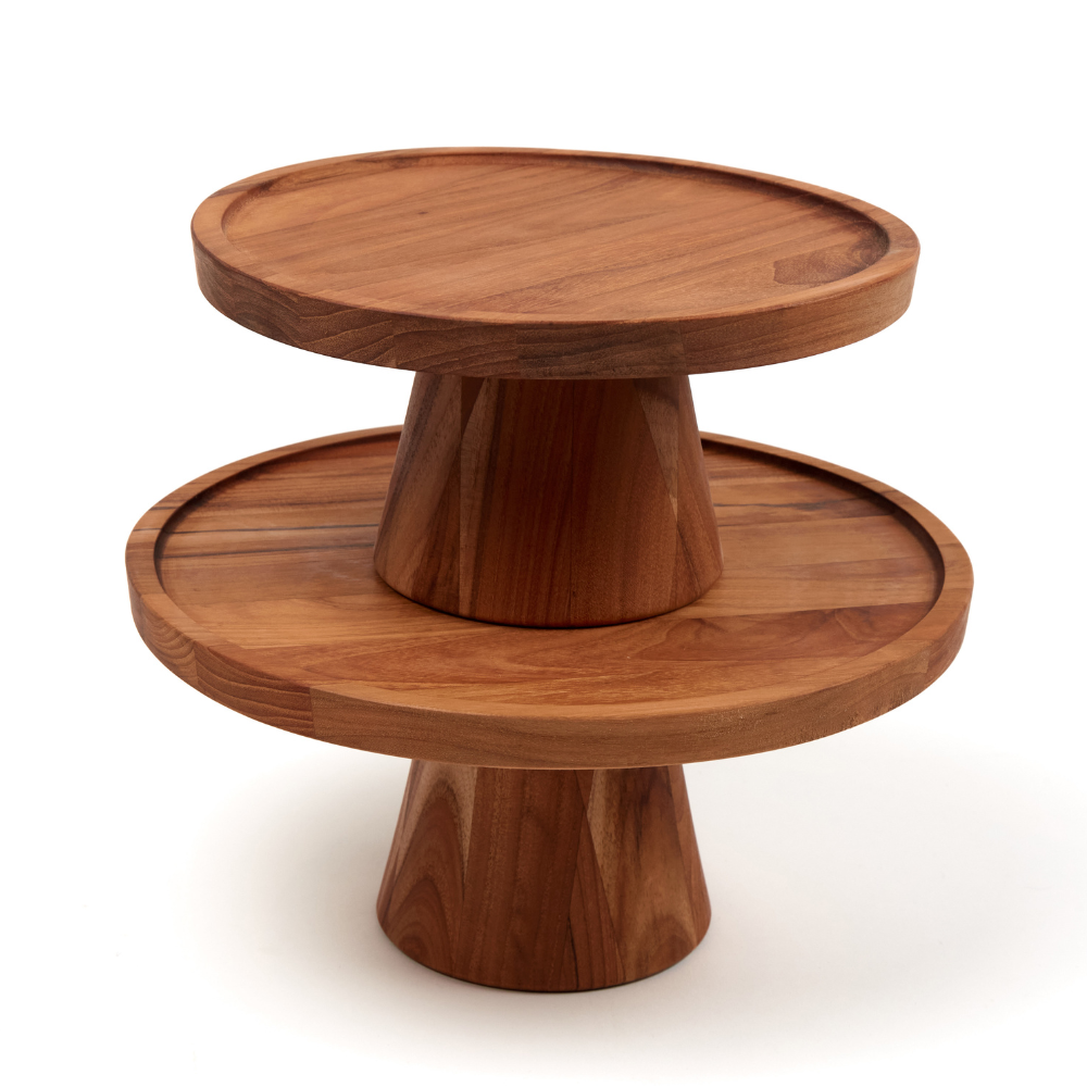 Stacked round teakwood cake stands with pedestal bases featuring rich natural wood grain on a white background.