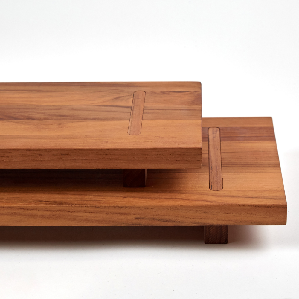 Modular teakwood fusion food stand with tiered levels and rich natural wood grain patterns.