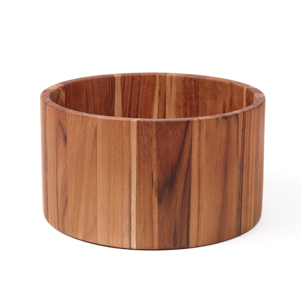 Small cylindrical teakwood salad bowl with a deep sculptural shape and natural wood grain isolated on white.