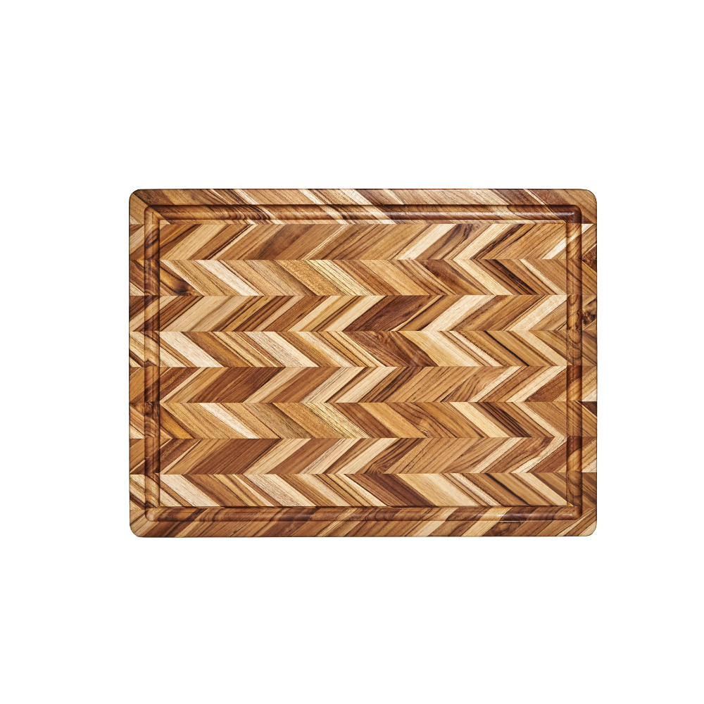 Extra large herringbone teakwood cutting board featuring a perimeter juice groove on a white background.