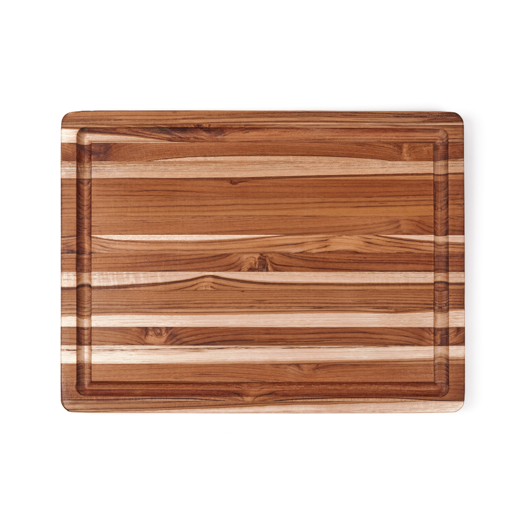 Large rectangular edge grain teakwood BBQ board with a deep juice canal and natural wood grain patterns.
