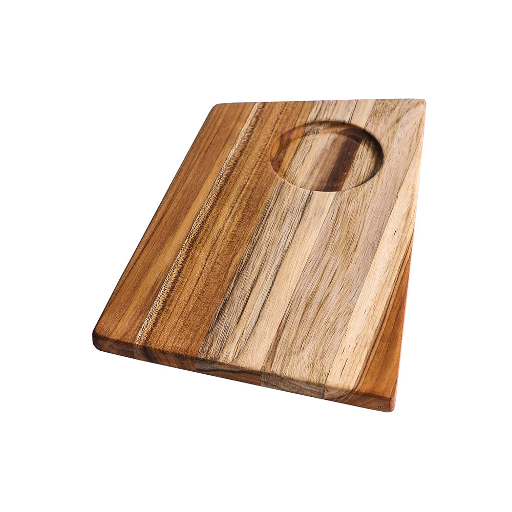 Small trapeze-shaped teakwood serving board featuring a circular bowl cutout and rich natural grain.