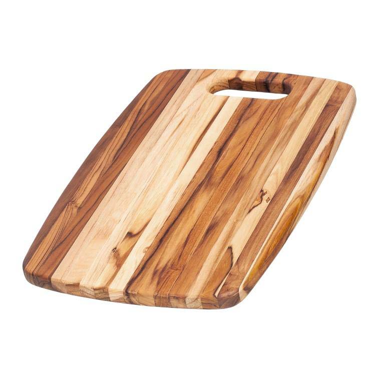 Edge grain teak chopping board from the Marine Collection featuring a rounded hole handle and curved corners.