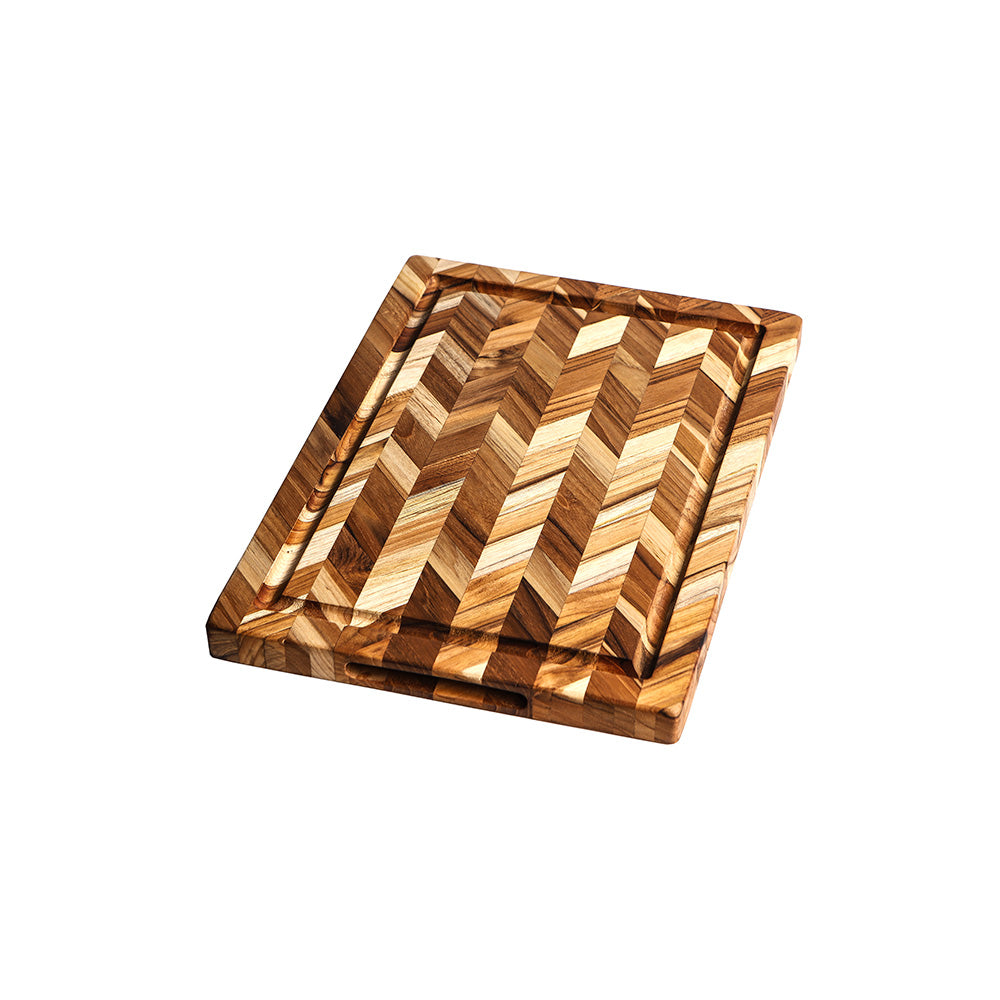 Medium thickness teakwood cutting board with a decorative herringbone pattern and perimeter juice groove.