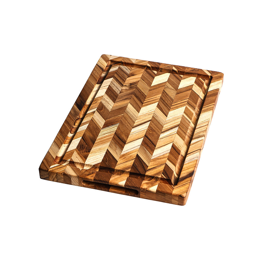 Rectangular teakwood cutting board featuring a decorative herringbone pattern and built-in juice groove.