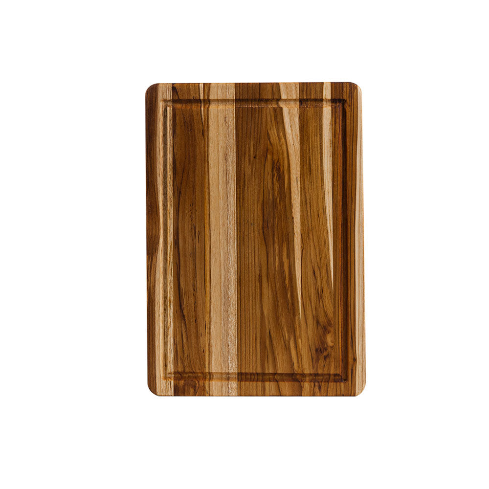 Rectangular teakwood cutting board with a perimeter juice canal and rich edge grain pattern.
