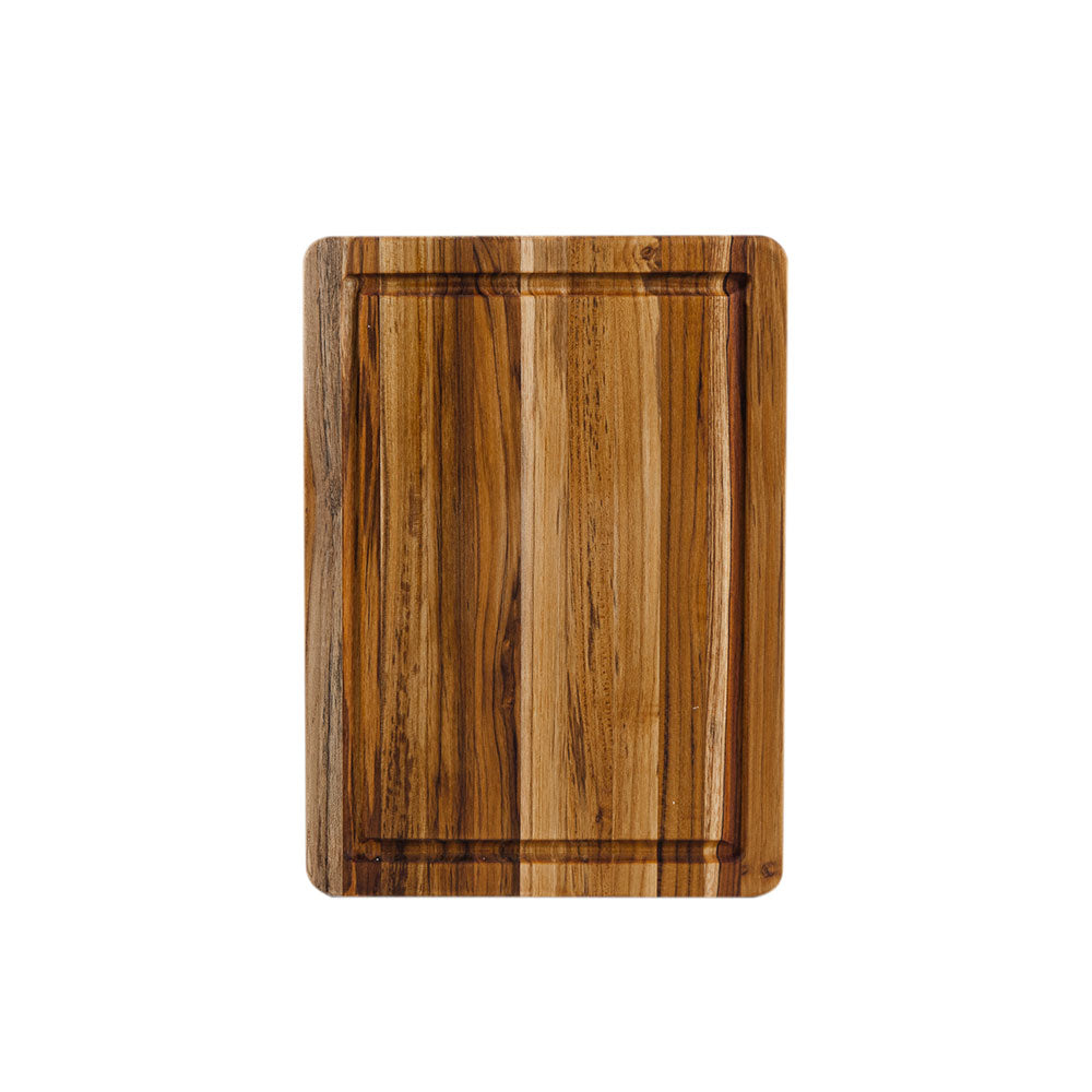 Rectangular teakwood edge grain cutting board featuring a perimeter juice canal and warm natural wood tones.